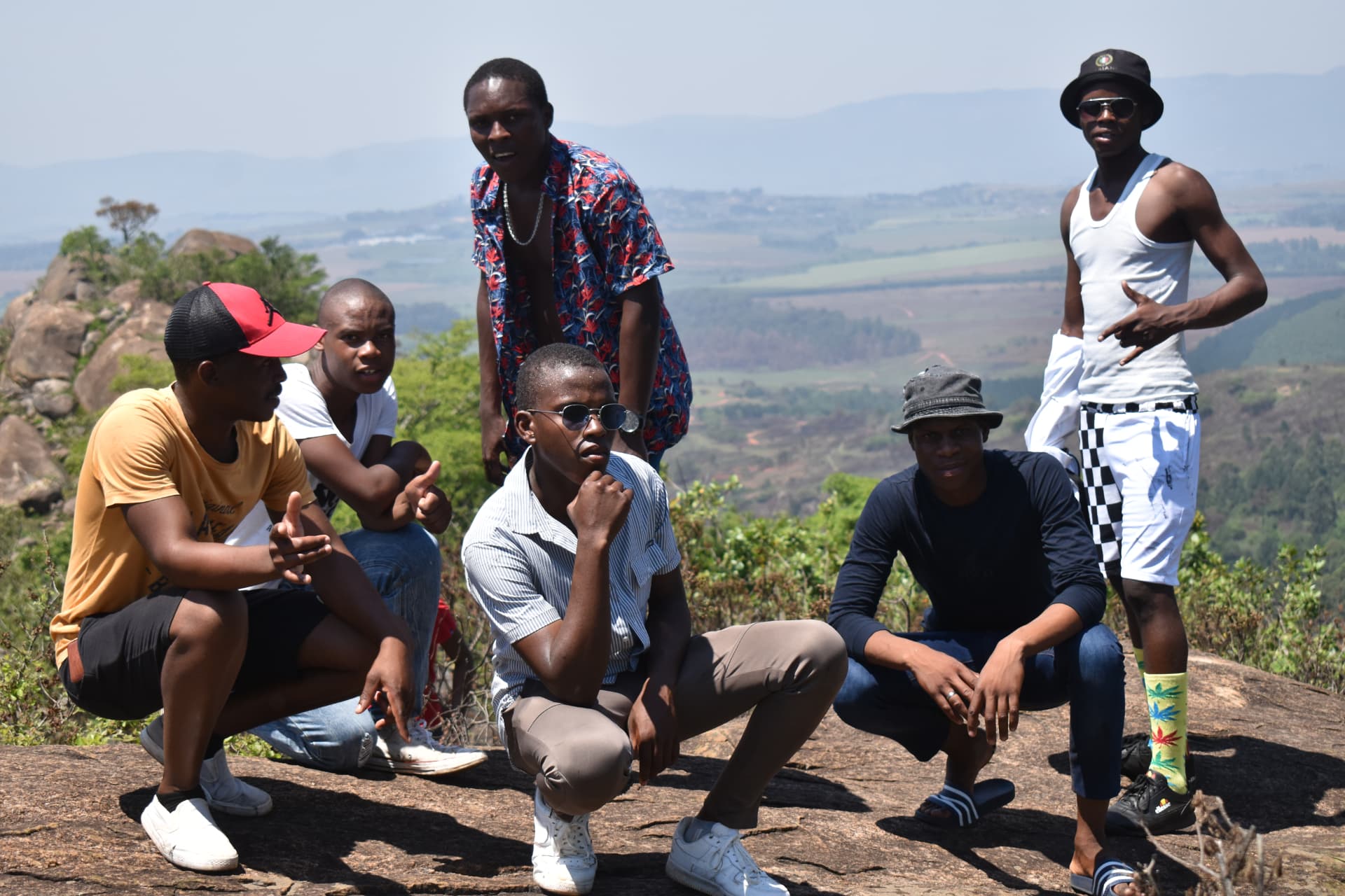 OFF Lisango young men on a mountain summit