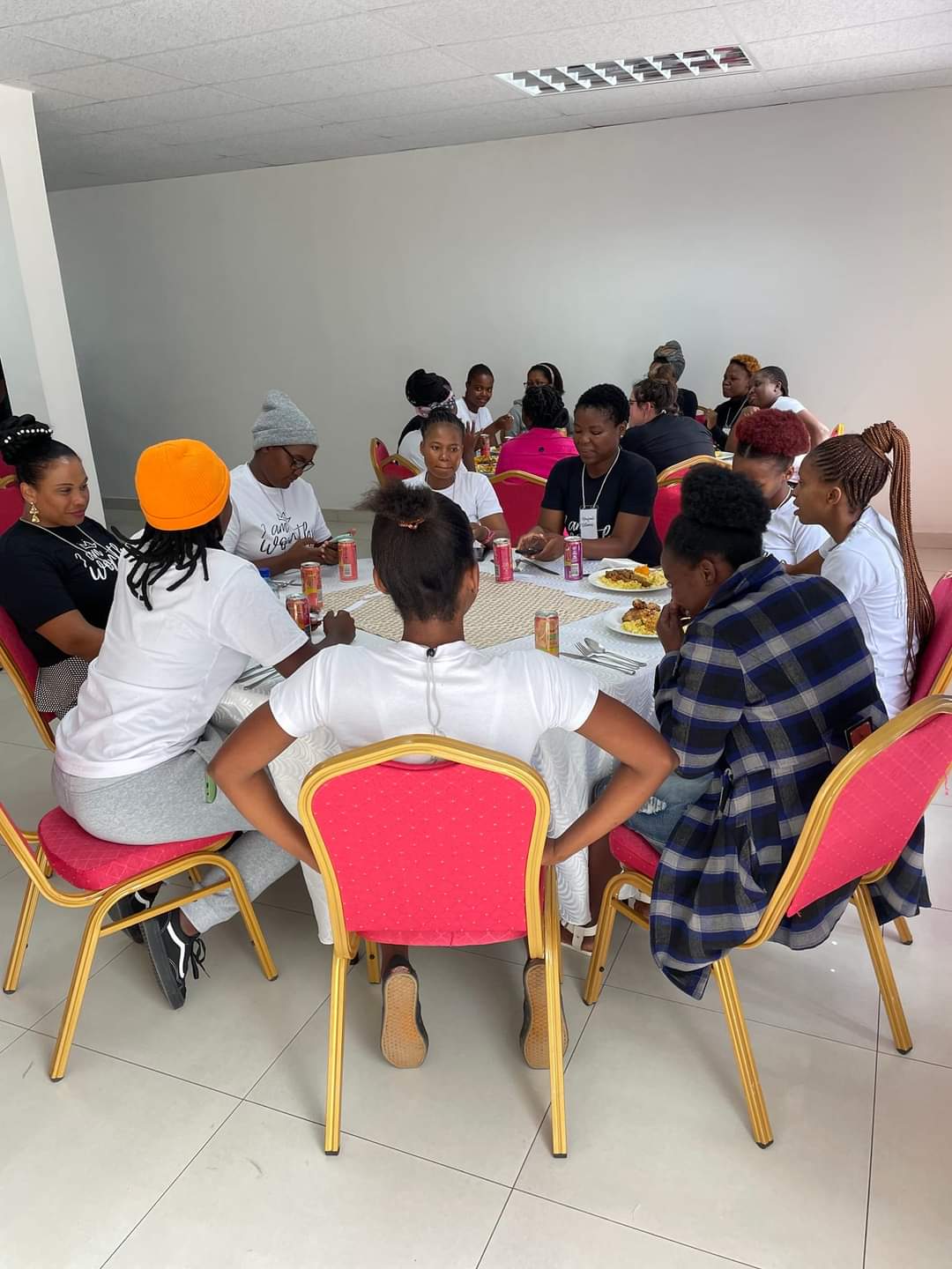3W women sharing a meal around a table