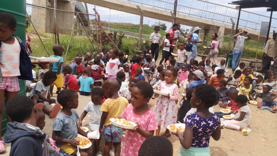SPCDC reachout day — community feeding under the bridge