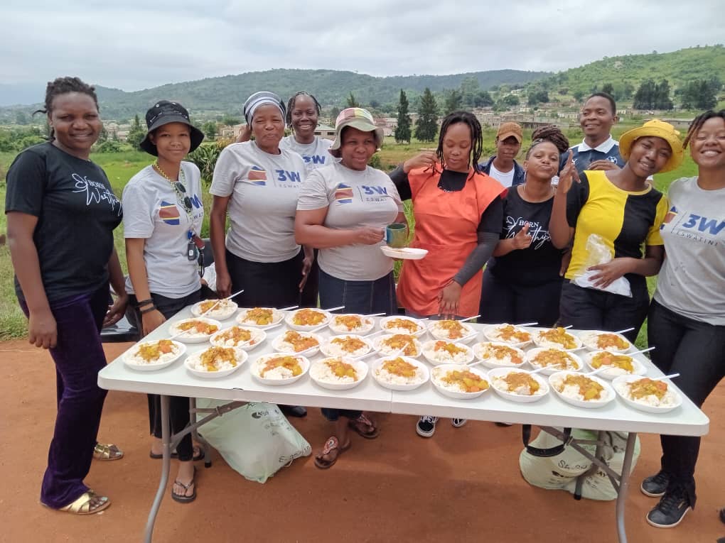 SPCDC volunteers serving meals to the community